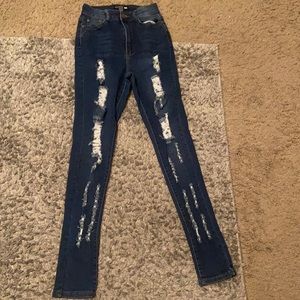 I am selling a pair of high rise blue Fashion Nova jeans.